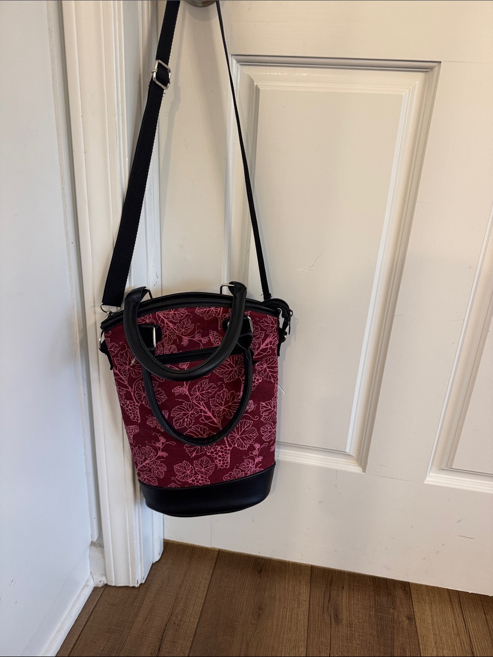 Burgundy floral insulated wine tote with Black Trim. NWOT. Will hold two bottles